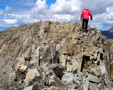 Victory! Gerry approaches the summit cairn
