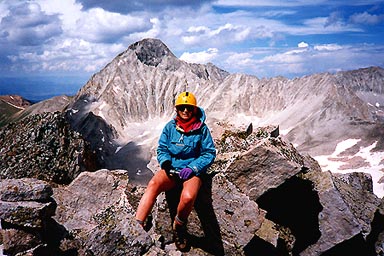 Jennifer on top of 'Siberia Peak' with Capitol Peak behind