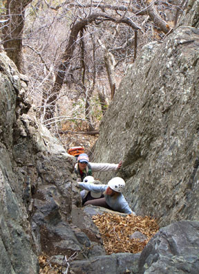 Debbie Hruza making the Class 4 move in the east-facing gully between the South and North Peaks