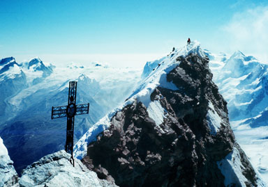 The Swiss Summit of the Matterhorn seen from the Italian Summit. 
				The Swiss Summit is the highpoint of the mountain