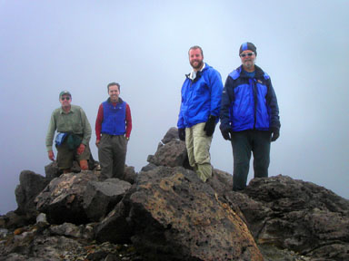 Success! Rick Trujillo, Jobe Wymore, Brad Alber and Chad Alber celebrate on the summit of Mount Griggs