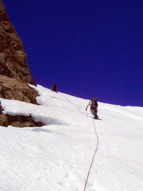 Gerry and John climbing the steep snow pitch